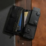Open leather wallet showing cash compartment and phone pocket